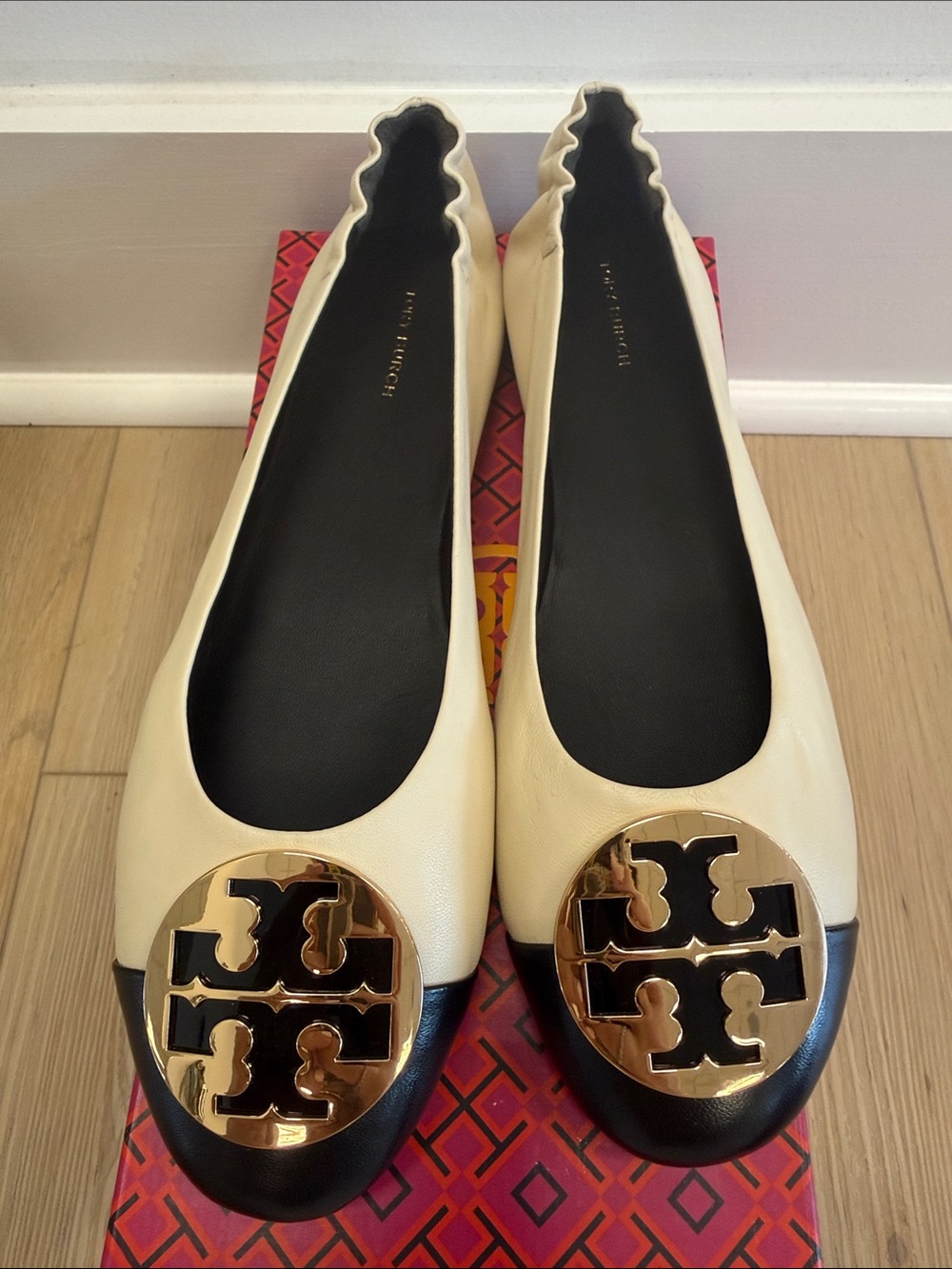Tory Burch Claire Cream Leather Ballet Flats with Black Cap Toe and Gold Logo